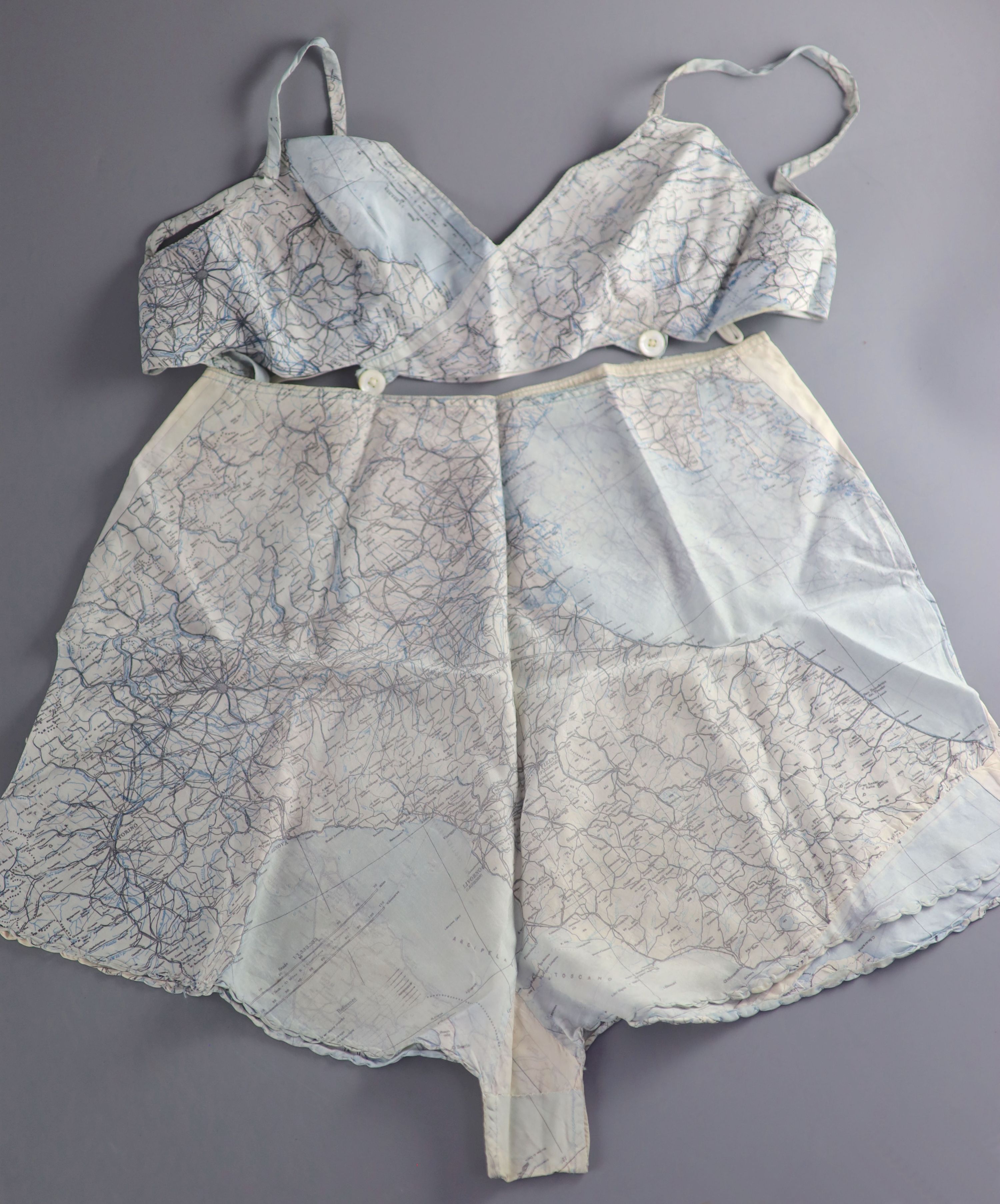 A novelty bra and cami knicker set, made from a silk printed escape map of Italy, used in the Second World War